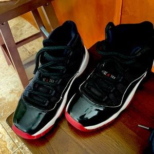 Jordan “BRED” 11, RED & BLACK.